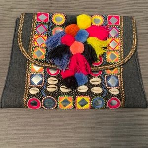 Denim pompom clutch